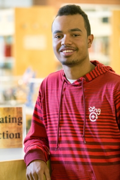 student in red shirt